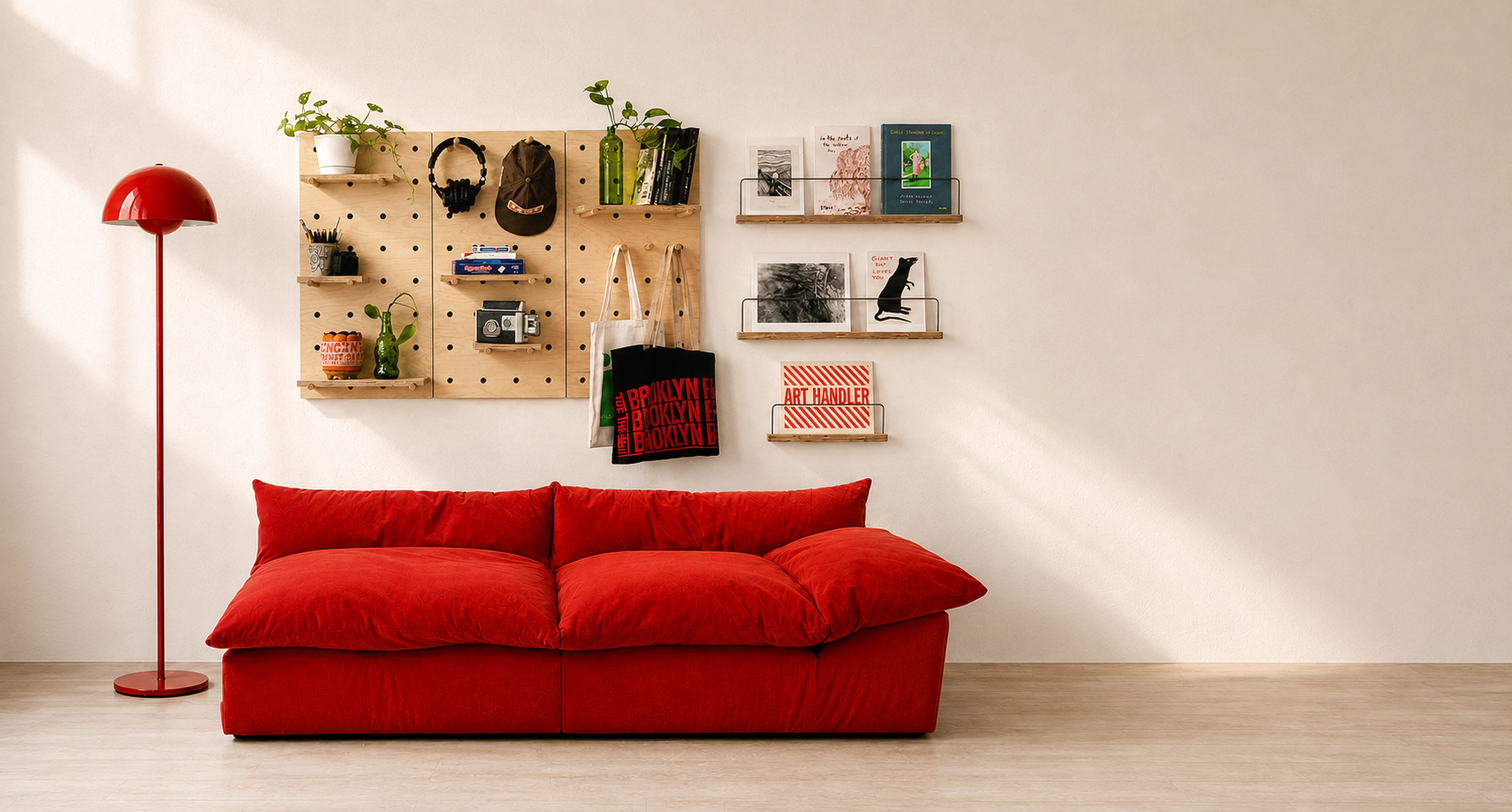 A modular Baltic birch pegboard and three Art Ledges arranged on a warm wall