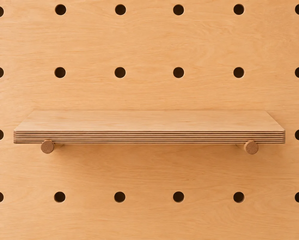 A large shelf on a Baltic birch pegboard