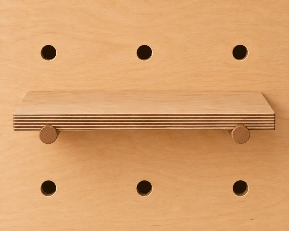 A medium shelf on a Baltic birch pegboard