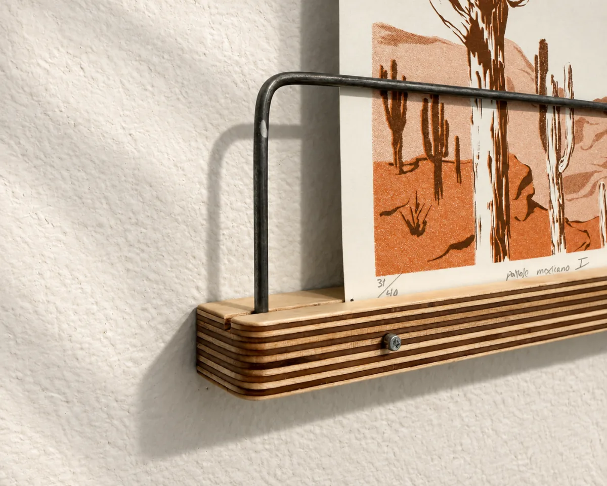 Close corner view of the 16-inch Art Ledge holding a screen print
