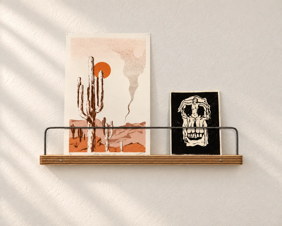 16-inch Art Ledge holding a screen print and a small artwork