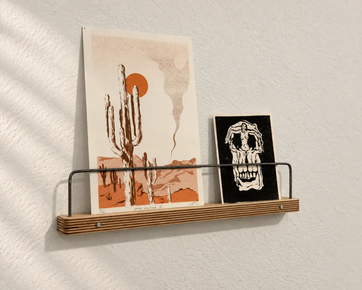 16-inch Art Ledge holding a screen print and a small artwork, seen at an angle
