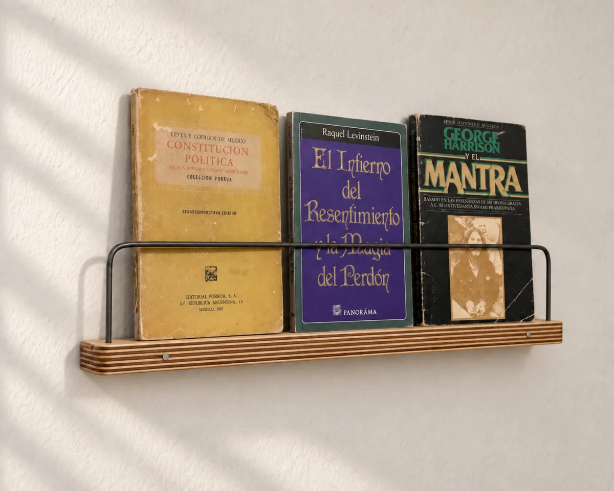 16-inch Art Ledge holding three paperback books, seen at an angle
