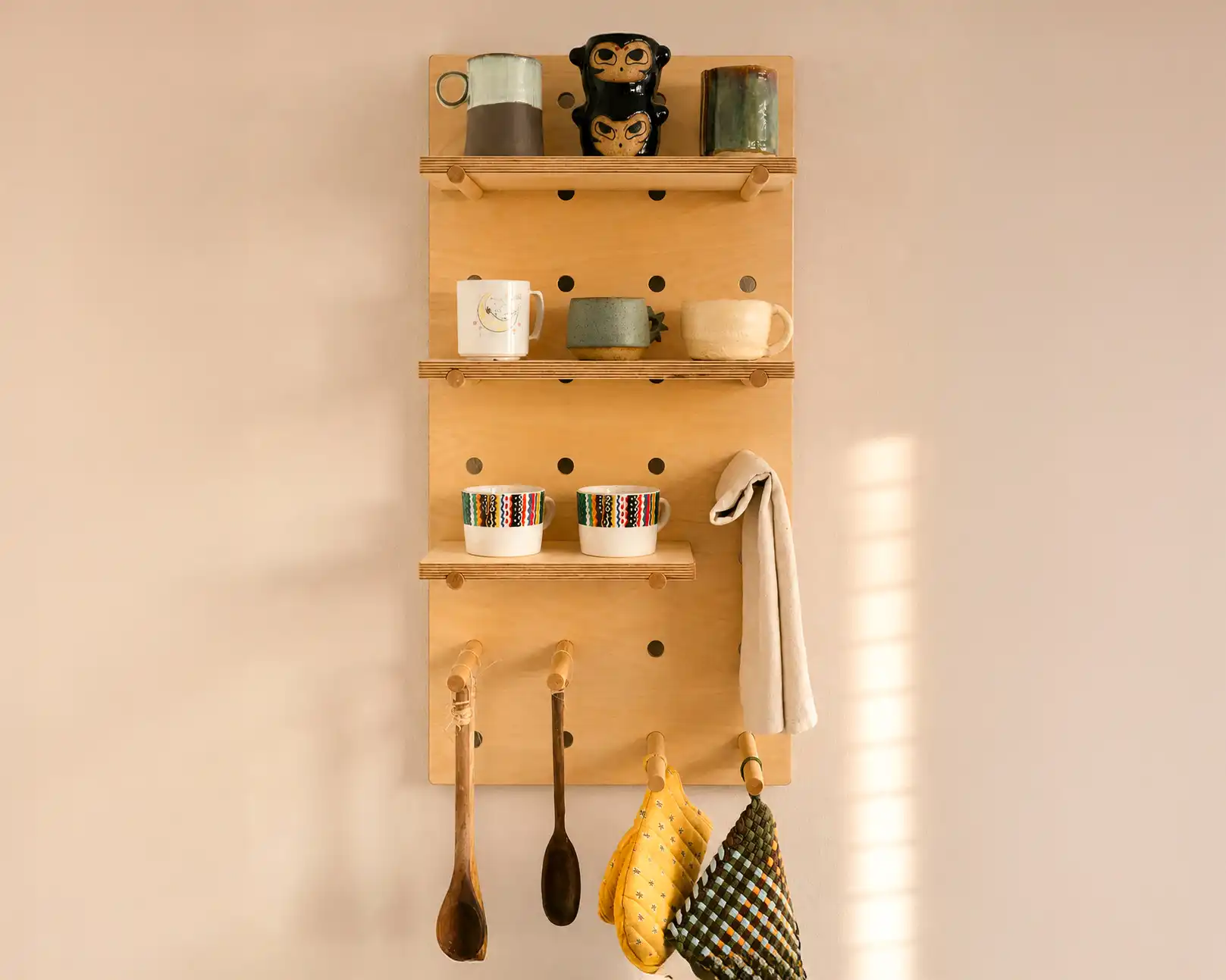 Starter 1 by 1 modular pegboard installed in warm natural light