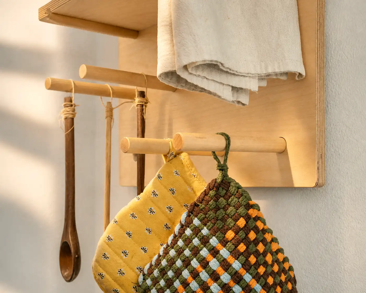 Close view of the Starter pegboard pegs, shelf edges, and Baltic birch grain