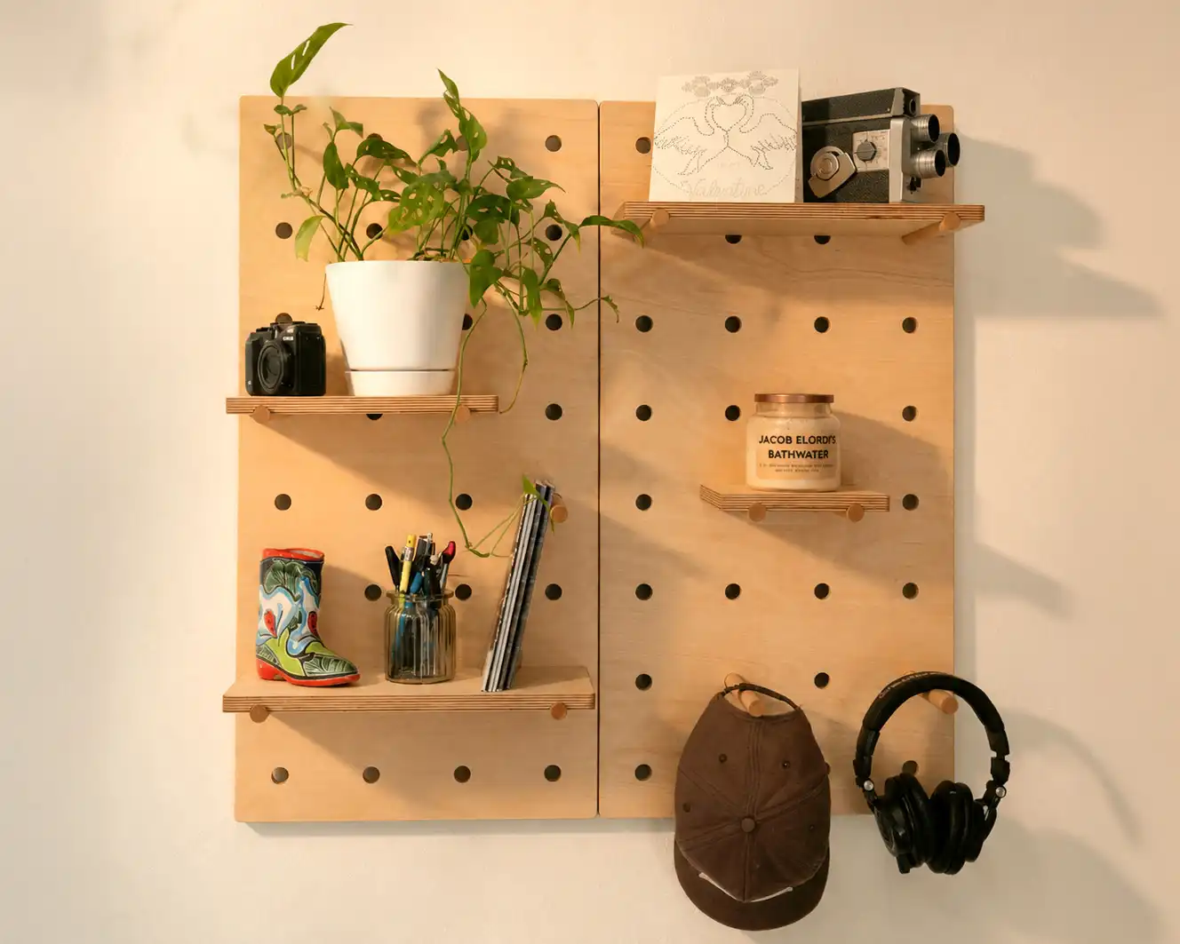 Pair 1 by 2 modular pegboard installed in warm natural light