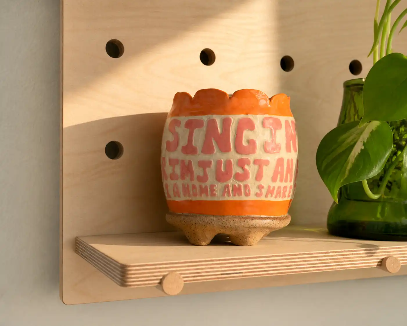 Close view of the Pair pegboard pegs, shelves, and Baltic birch grain