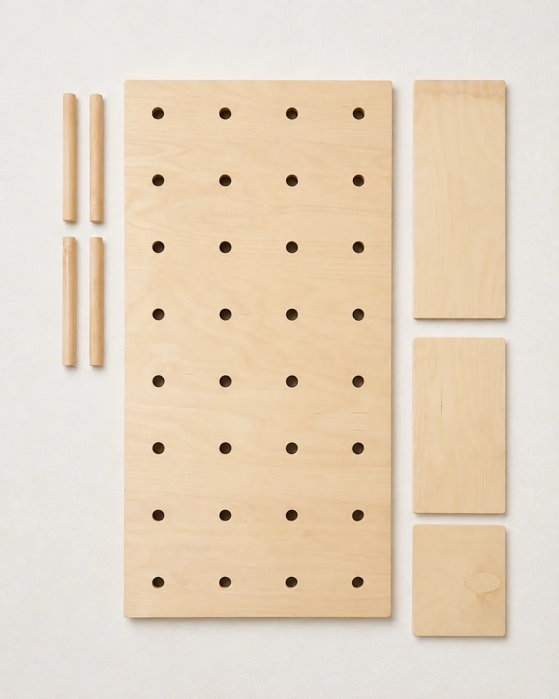 Pair pegboard components arranged to show the included modules, shelves, and pegs