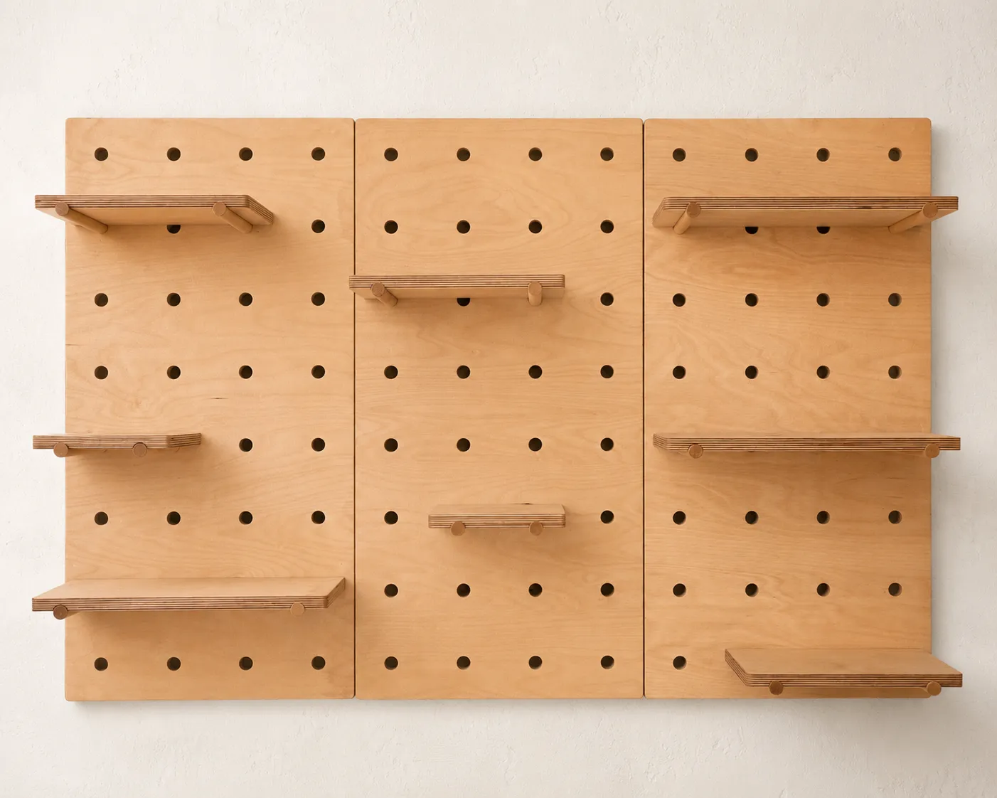 Gallery pegboard shown empty with its nine shelves and six pegs installed